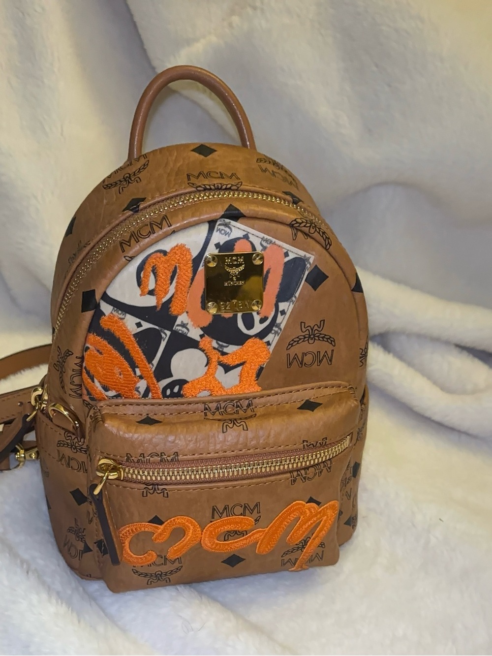 MCM Cognac Visetos Mini Backpack with Orange Embroidered Accents